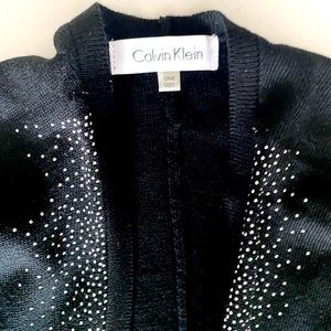 NWT Calvin Klein cape color: black with silver details size: OS